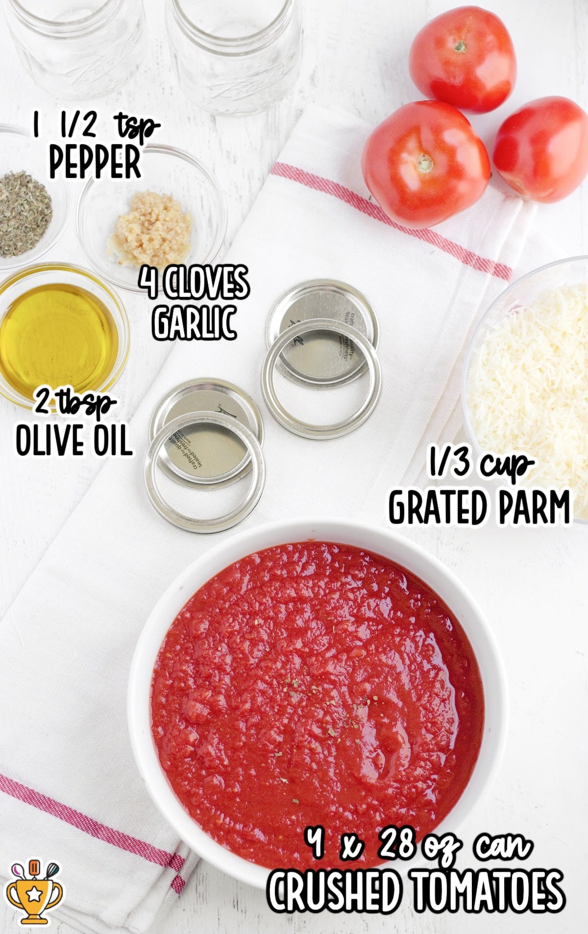 Flat lay of ingredients for homemade tomato sauce including crushed tomatoes, olive oil, garlic, grated parmesan, and seasoning.