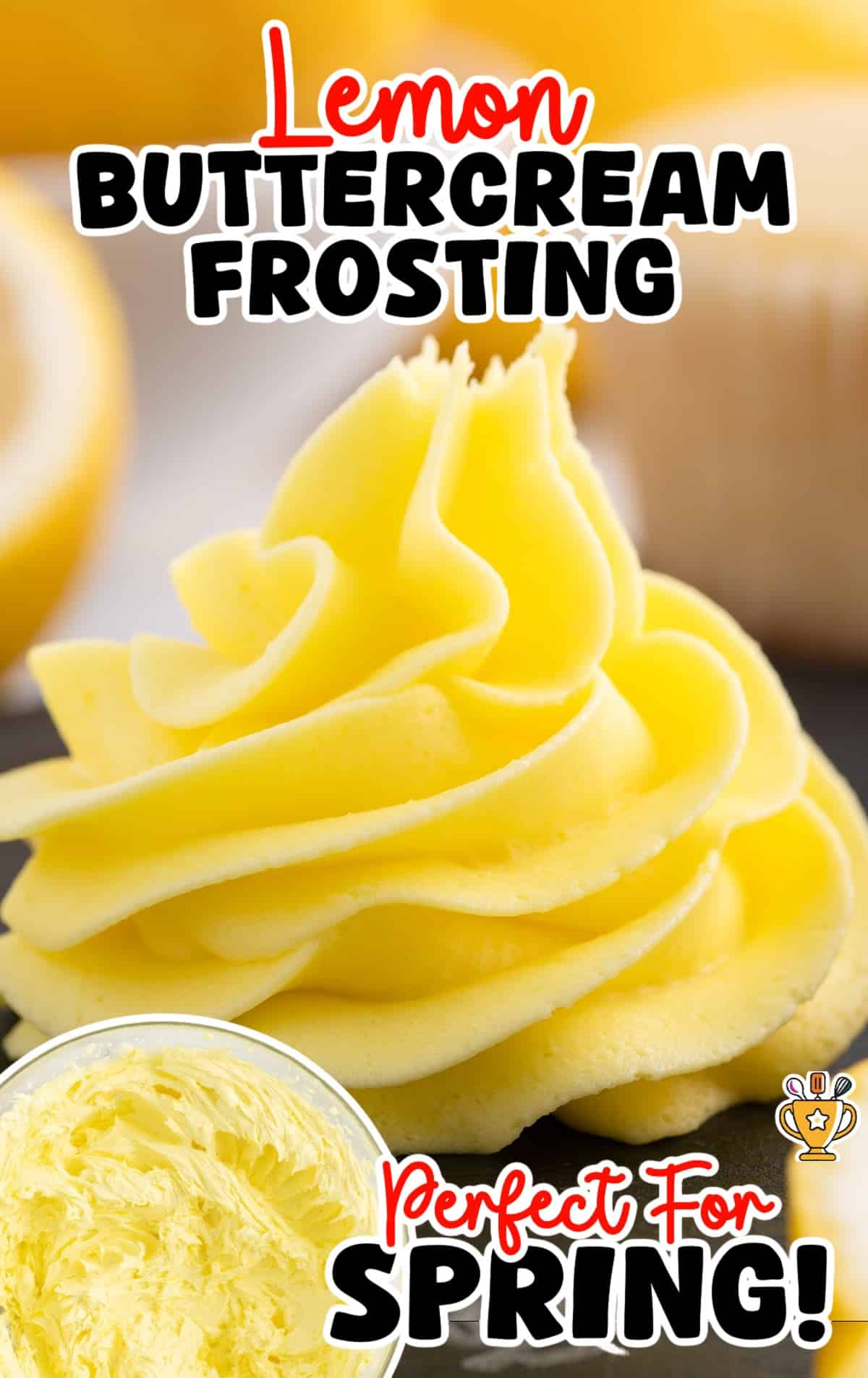 Close-up of piped lemon buttercream swirl in front of a blurred lemon cupcake background.
