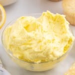 Labeled ingredient photo and measurements for lemon buttercream frosting, including butter, sugar, lemon juice, zest, and food color.