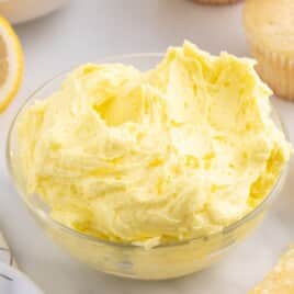 Labeled ingredient photo and measurements for lemon buttercream frosting, including butter, sugar, lemon juice, zest, and food color.