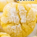 Tall Pinterest pin image featuring a close-up of a single powdered lemon crinkle cookie, with text &ldquo;Easy Lemon Crinkle Cookies&rdquo; and a callout for sweet powdered coating.