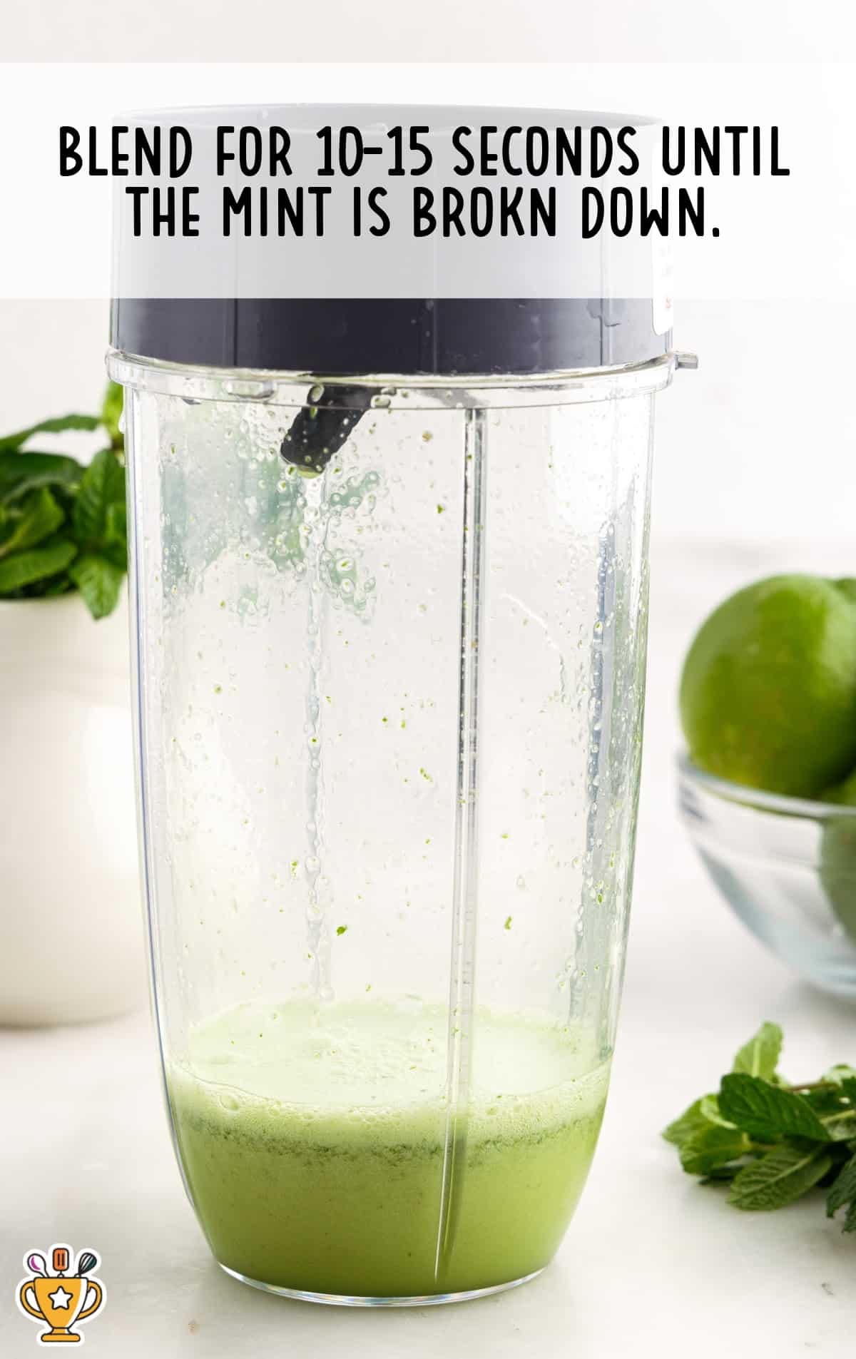 Blended mint margarita mixture in a blender, showing smooth green liquid after blending for 10-15 seconds.