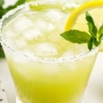 Tall vertical image of a mint margarita with lemon and mint, labeled "Perfect for Summer" and featuring a bowl of limes.