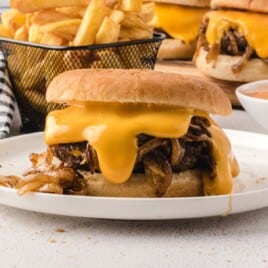 Flat lay of Oklahoma fried onion burger ingredients, including buns, cheese, ground beef, seasonings, and condiments.