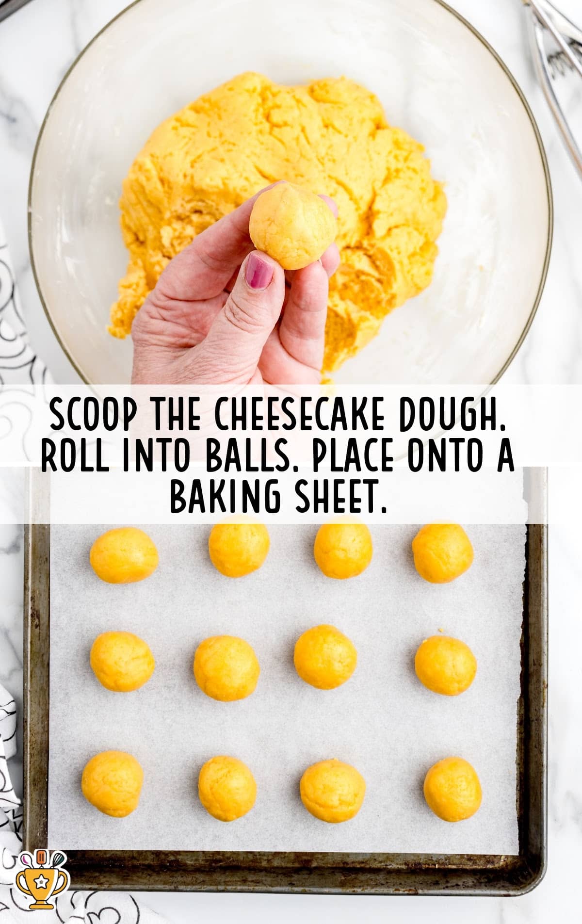 Hand forming a truffle ball from the orange dough over a bowl, with a baking sheet filled with evenly rolled balls lined up below.