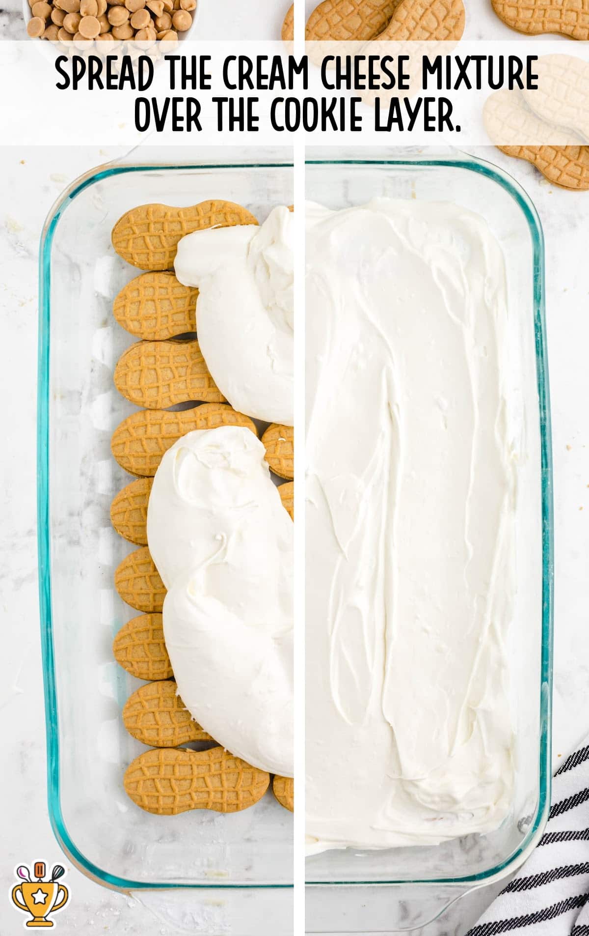 Glass baking dish showing the cream cheese mixture being spread over a base layer of cookies for peanut butter lasagna.