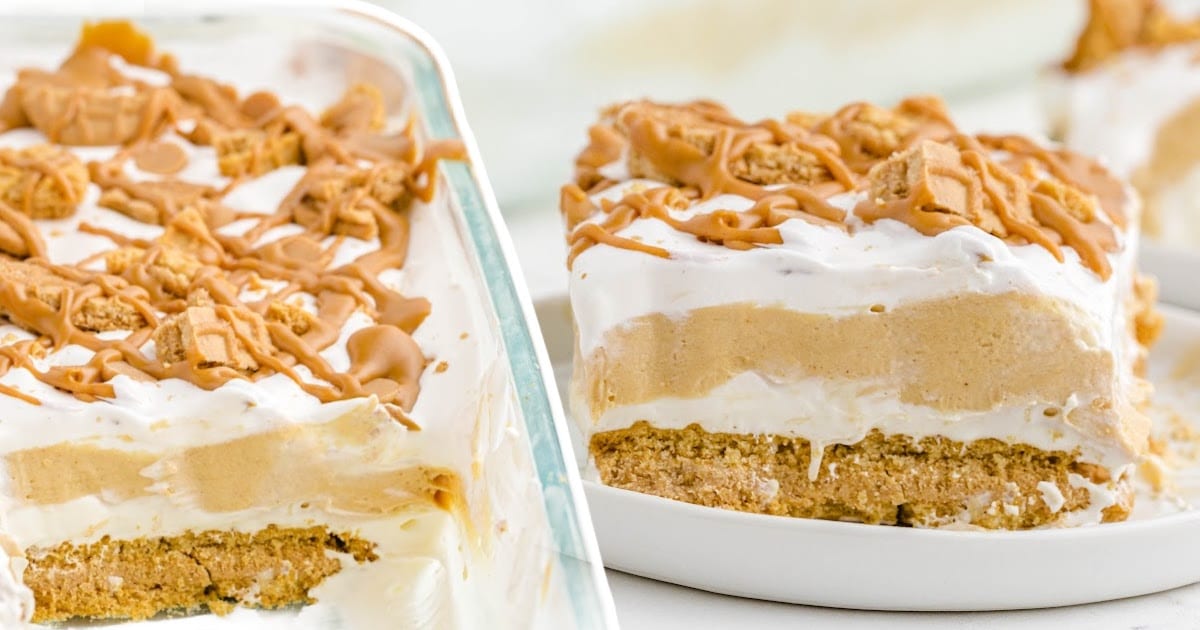 Peanut butter lasagna shown sliced in a baking dish and served on a plate, with layers of creamy filling and cookie crust.