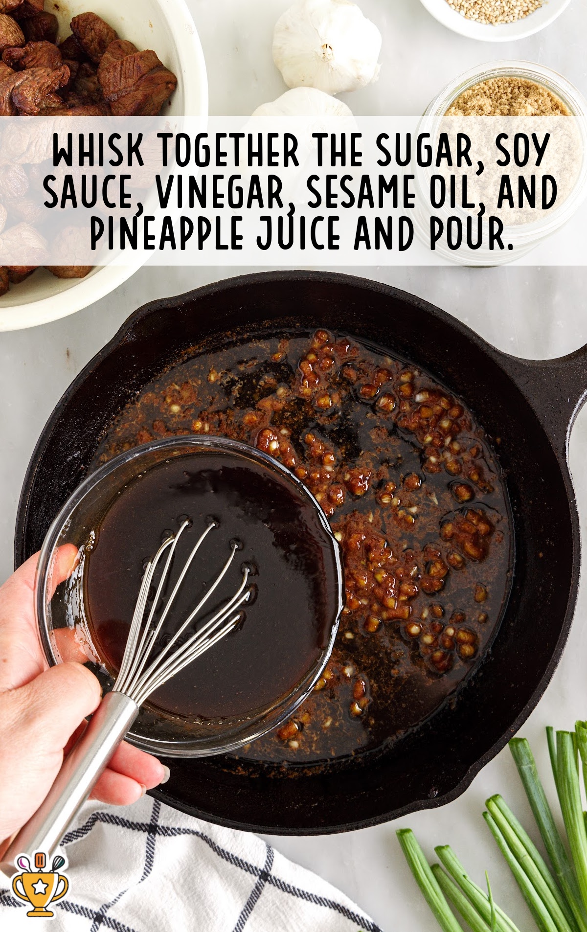 Whisking soy sauce, sugar, vinegar, sesame oil, and pineapple juice in a glass bowl over a skillet.