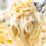 A creamy forkful of chicken tetrazzini being lifted from a cheesy casserole, topped with fresh parsley and melted cheese. Text overlay reads &ldquo;Chicken Tetrazzini &ndash; The Easiest Family Dinner!&rdquo; with a small image of the full casserole dish in the corner.