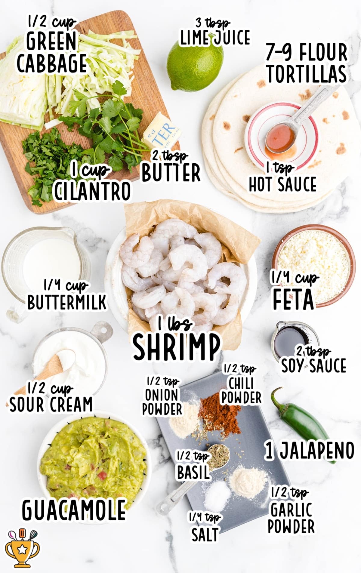 Labeled flat lay of shrimp taco ingredients, including shrimp, tortillas, cabbage, guacamole, spices, lime, feta, and more.