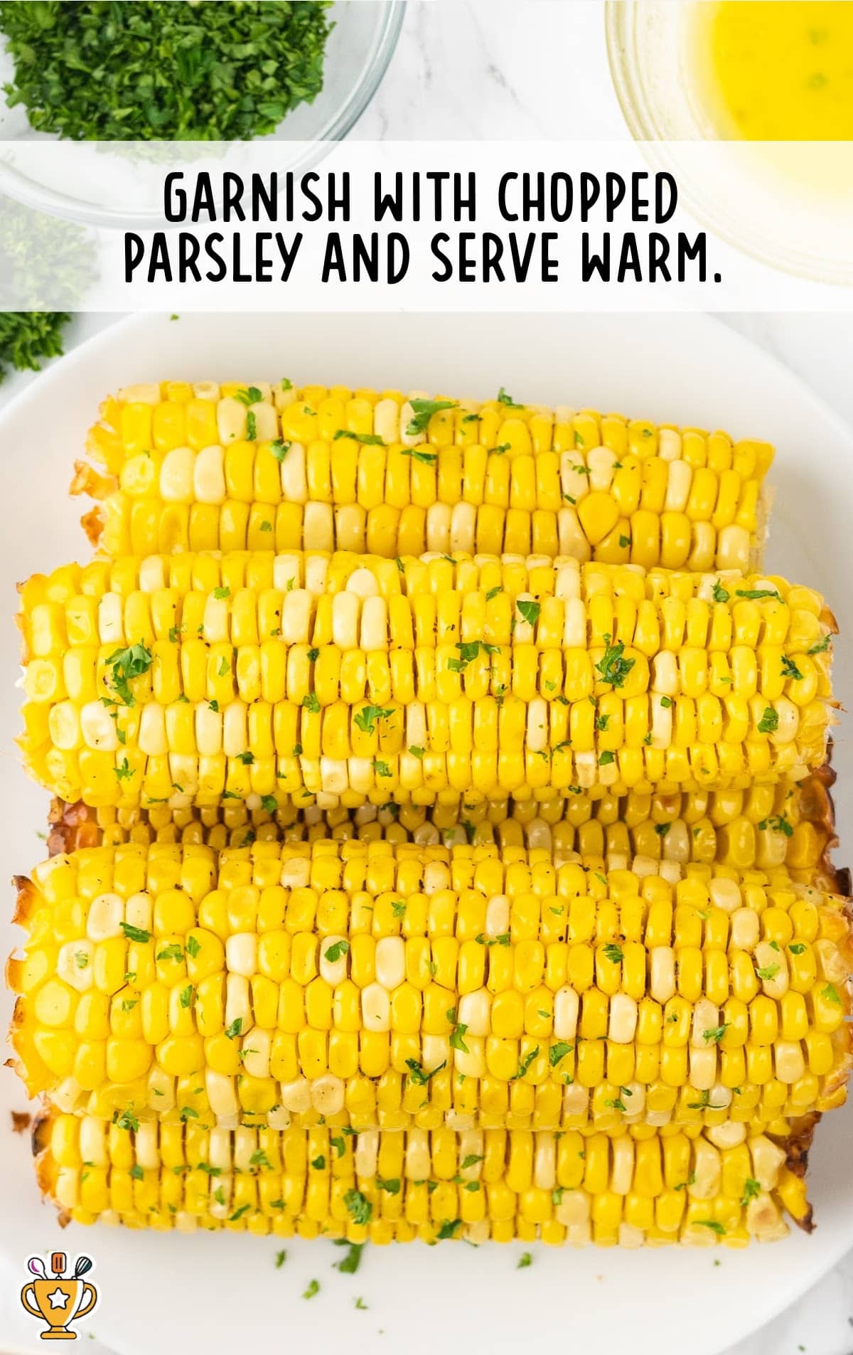 Air Fryer Corn on the Cob garnished with chopped parsley