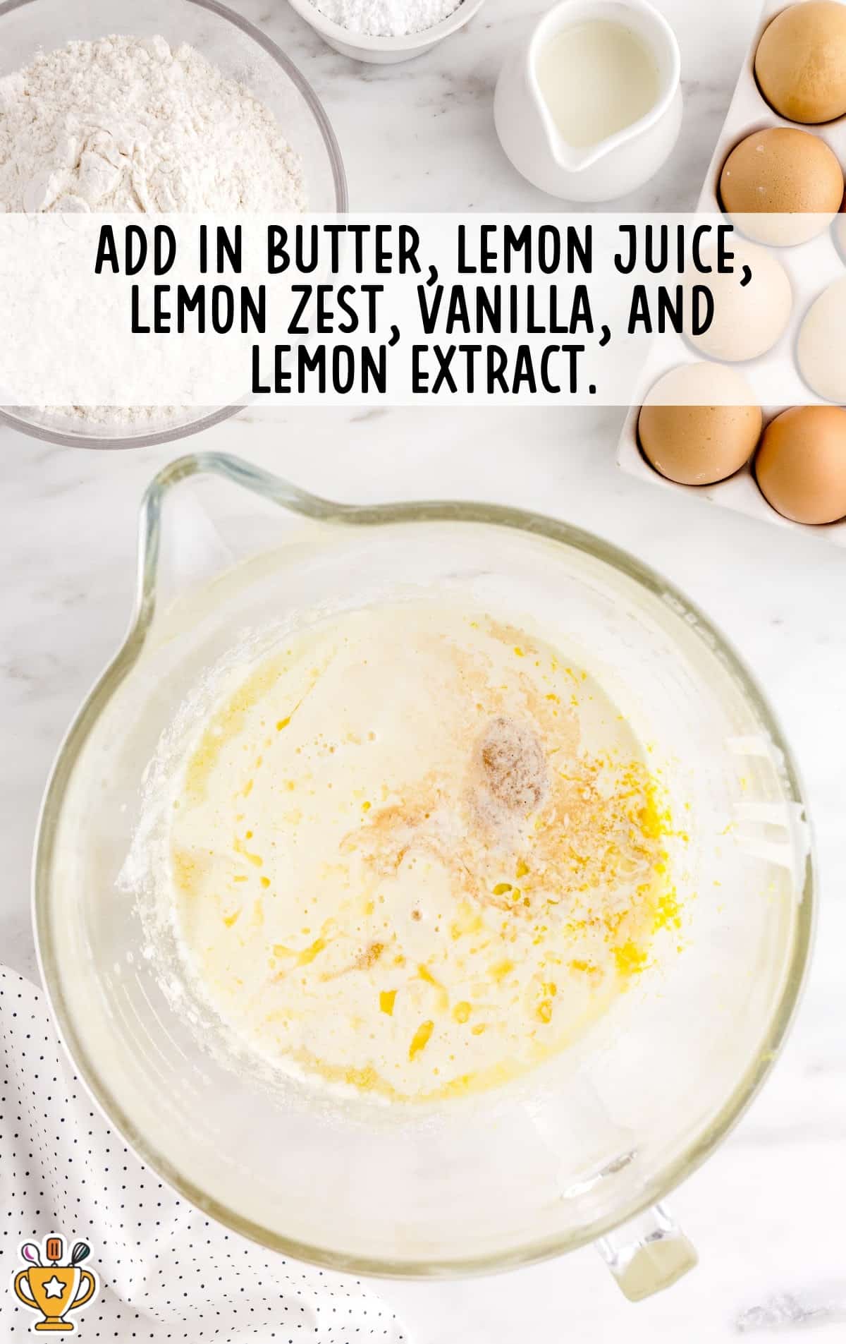butter, lemon juice, lemon zest, vanilla and lemon extract added in a bowl