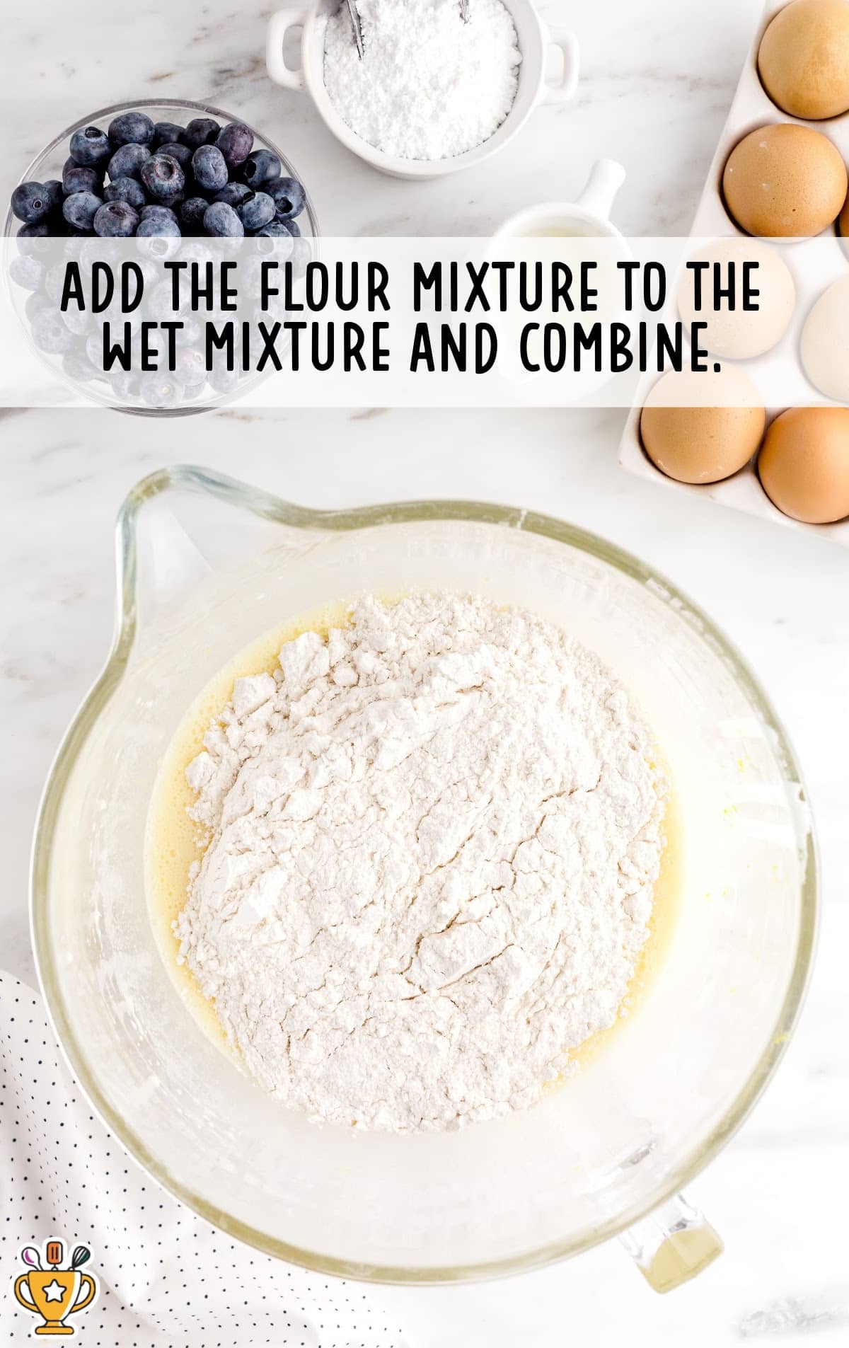 flour mixture added to the wet mixture in a bowl