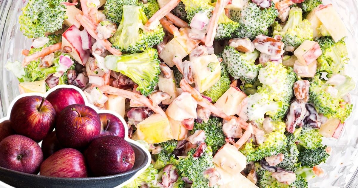 a close up photo of Broccoli Apple Salad and some apples in a bowl