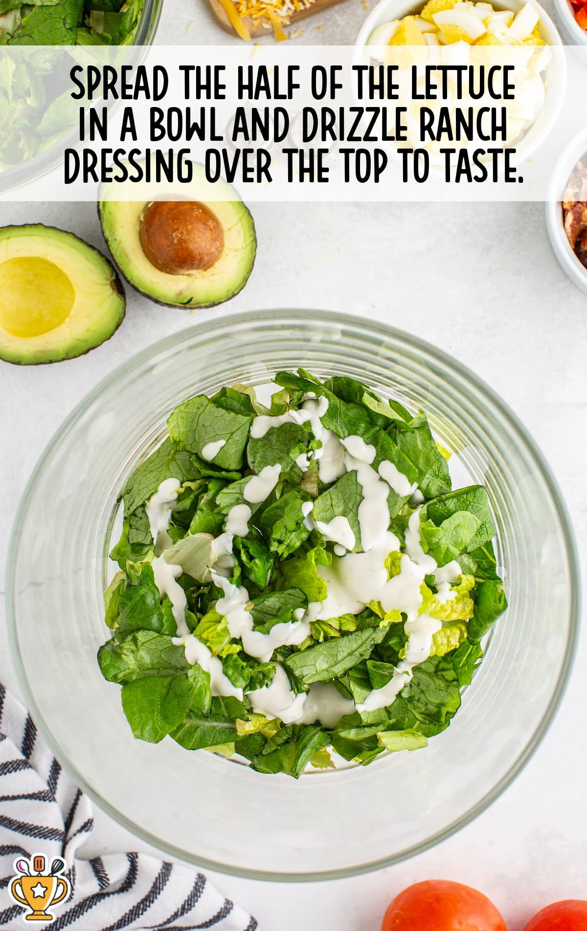 spreading the half of the lettuce in a bowl