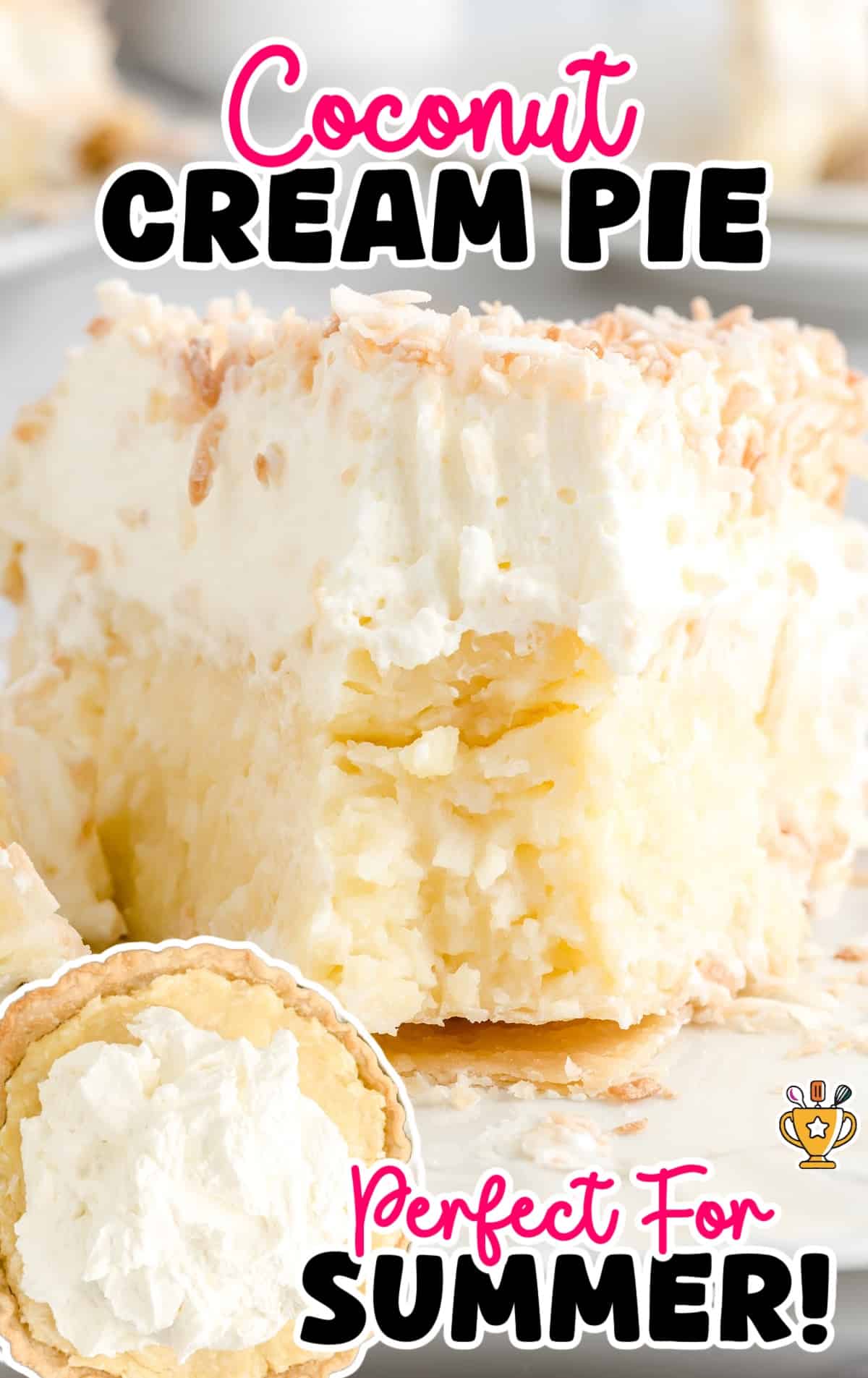 Whole coconut cream pie topped with toasted coconut flakes and piped whipped cream.