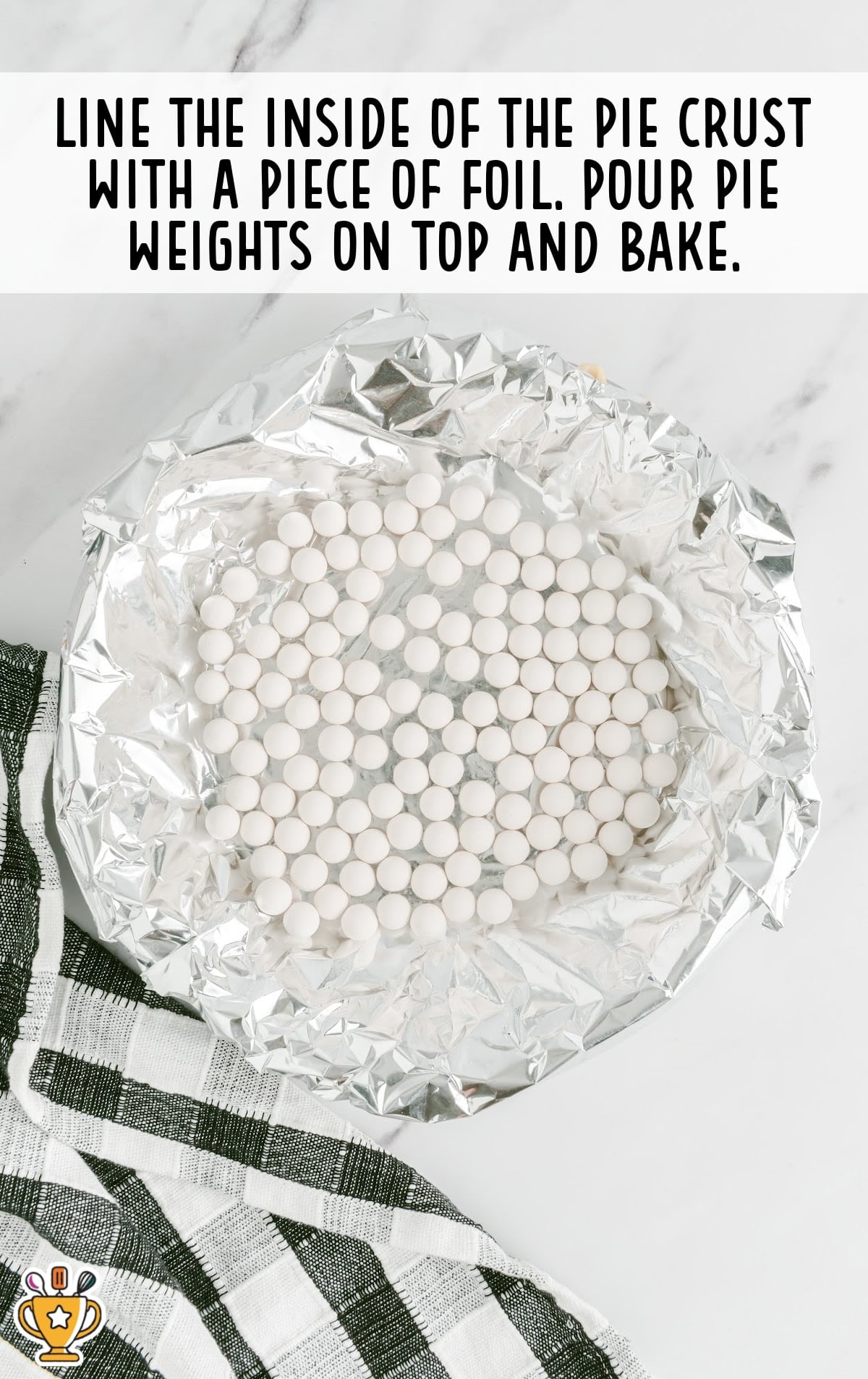 Preparing pie crust in a round pan before baking for coconut cream pie recipe.