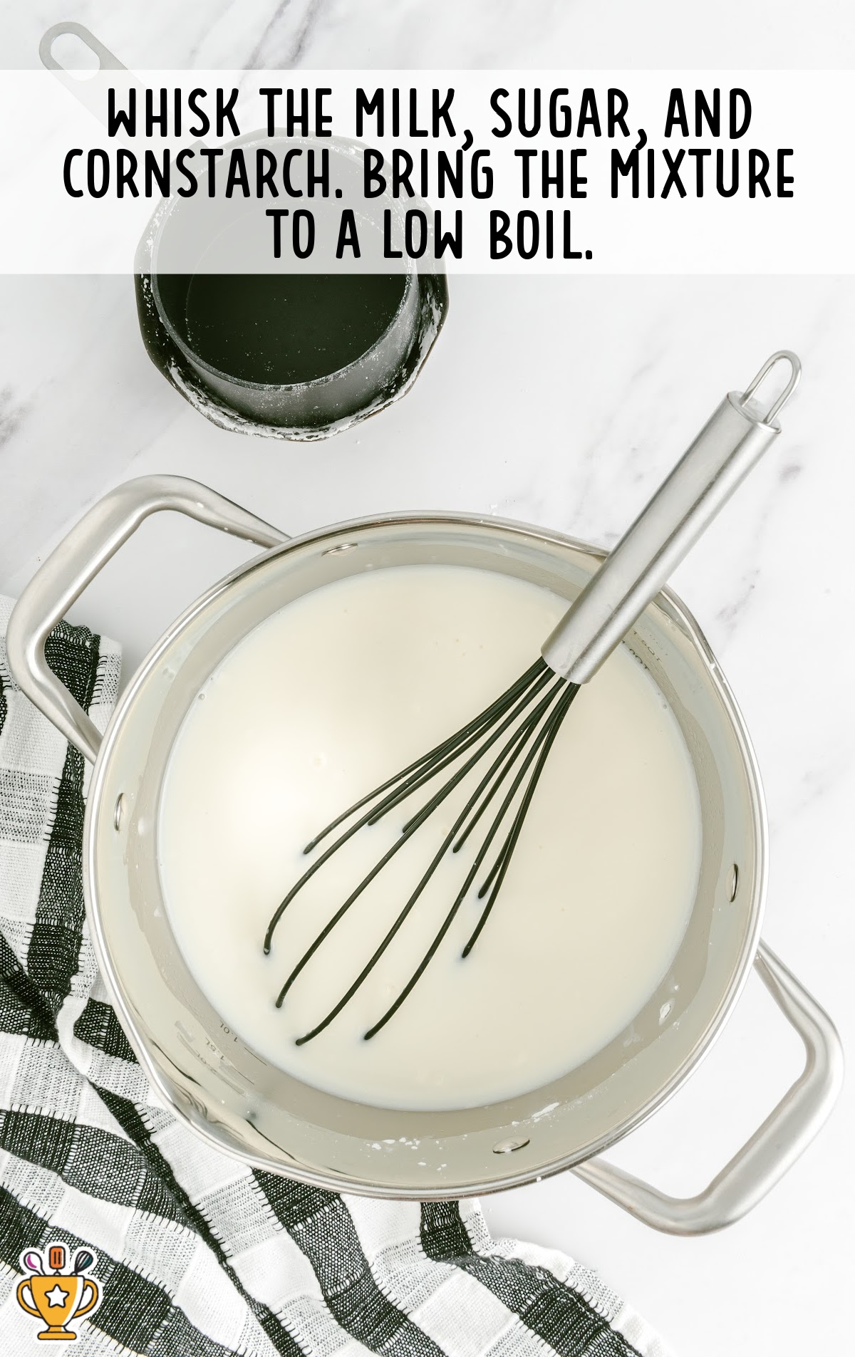 Whisking egg yolks with hot custard mixture to temper