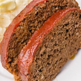Crockpot Meatloaf slices on a white plate