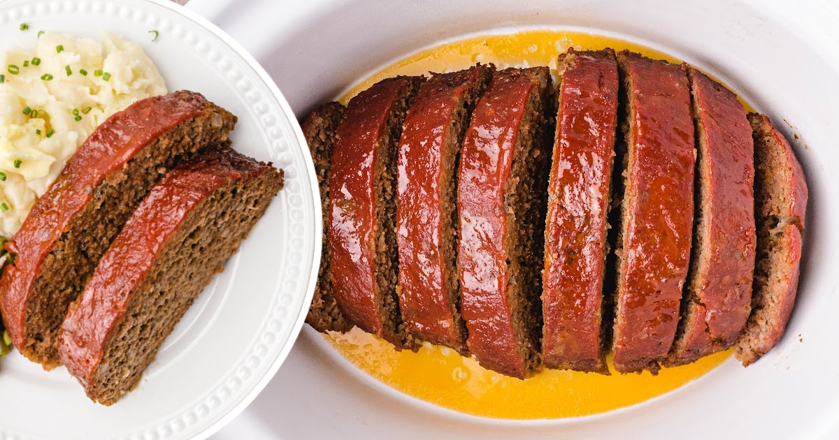 Crockpot Meatloaf cut into slices and two slices on a white plate
