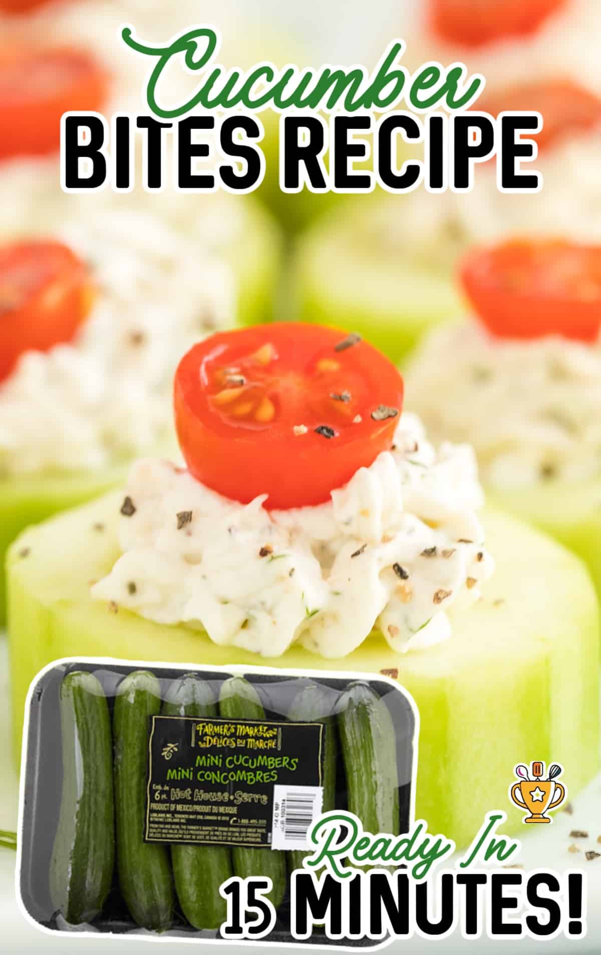 Close-up view of cucumber bites topped with creamy dill filling and halved cherry tomatoes, neatly arranged on a white platter.