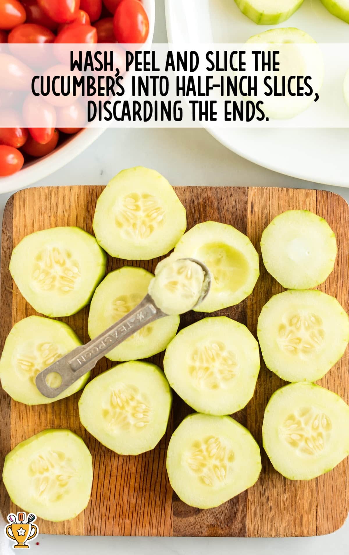 Peeled and sliced cucumber rounds arranged on a wooden cutting board with a measuring spoon, ready for stuffing.