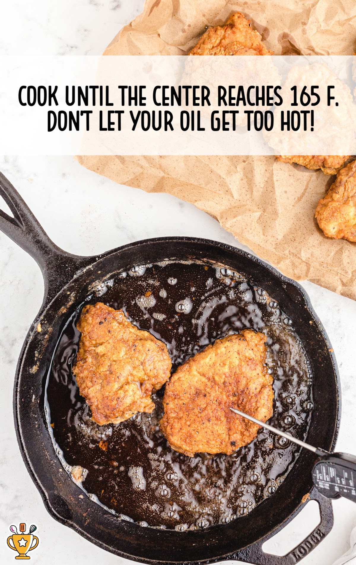 Pan-fried pork chops resting on a paper towel after being cooked to golden perfection, ready to serve.