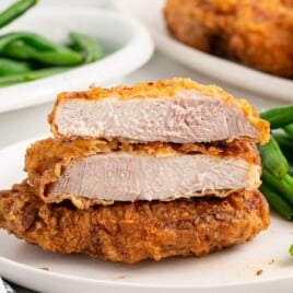 Recipe card showing ingredients and instructions for making pan-fried pork chops, including details on seasoning and cooking.