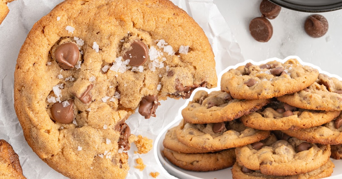 A delicious batch of gluten-free chocolate chip cookies arranged neatly on a plate. The cookies are soft, with visible chocolate chips and a sprinkle of coarse sea salt on top.