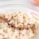 a bowl of Hawaiian Macaroni Salad with a wooden spoon in it
