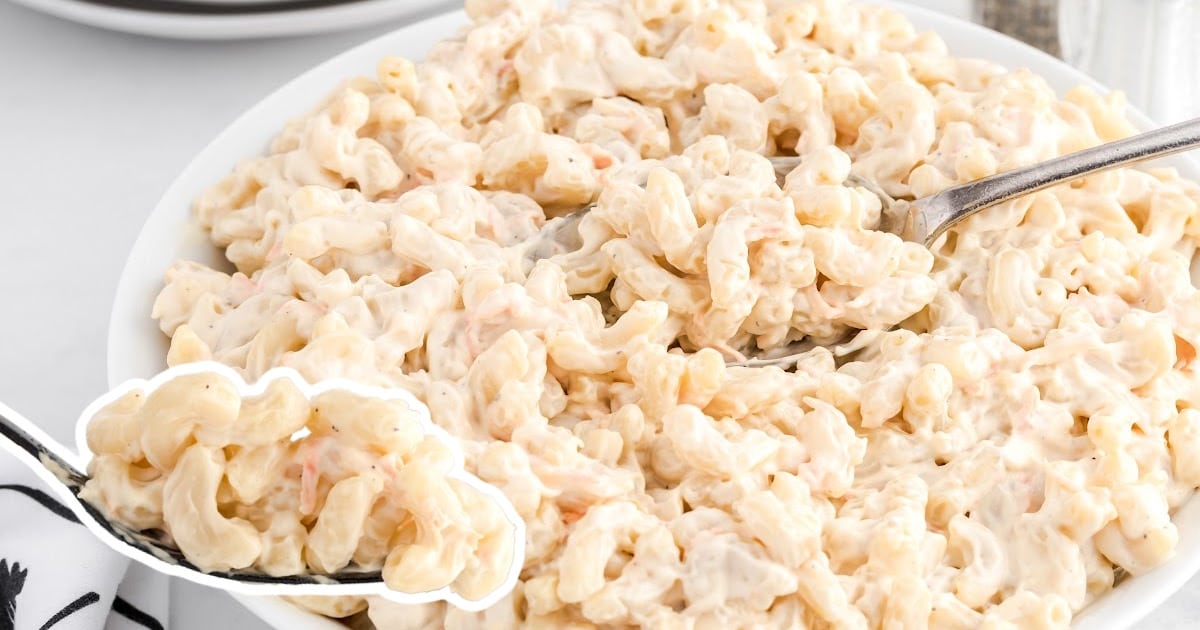 a white bowl of Hawaiian Macaroni Salad with two spoon