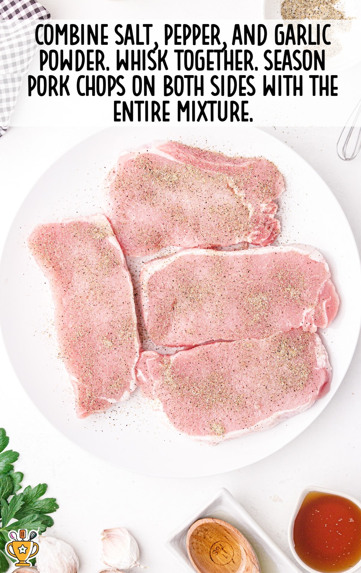 combining salt, pepper and garlic powder and whisking together over the pork chops