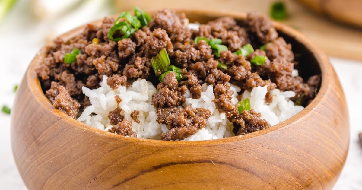 a close up photo of Korean Beef with white served rice in a bowl