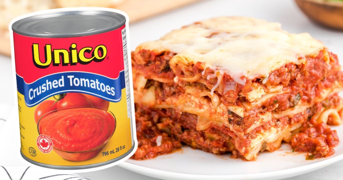 Lasagna on a plate and a can of crushed tomatoes on the side
