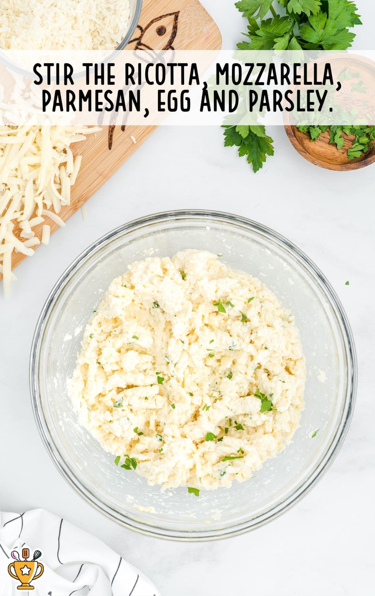 ricotta, mozzarella, parmesan, egg and parsley added into the bowl