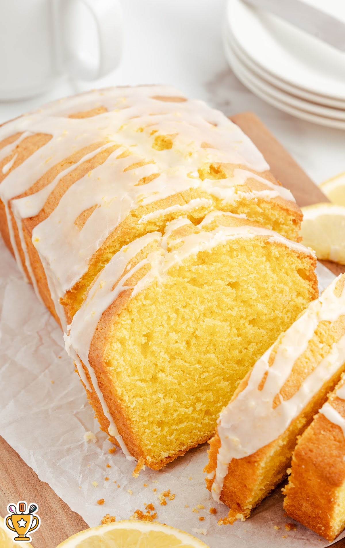 a whole Lemon Pound Cake with three cut slices