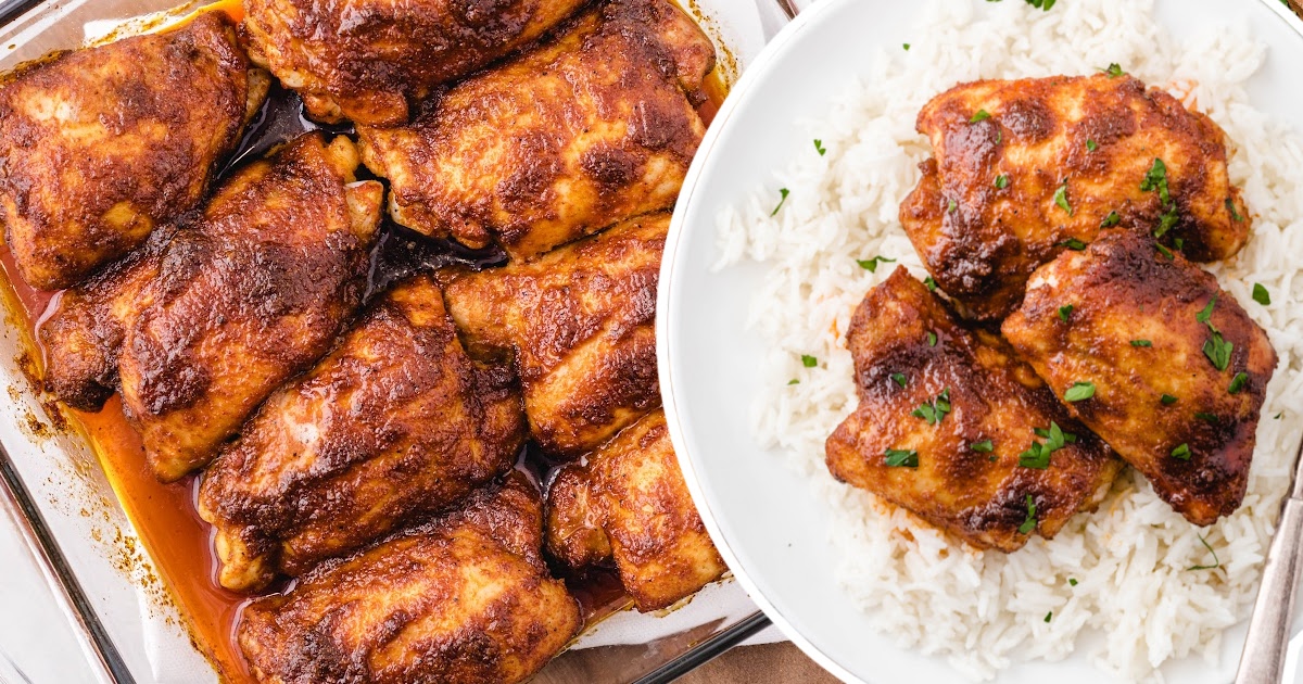 Paprika Chicken over rice on a white plate