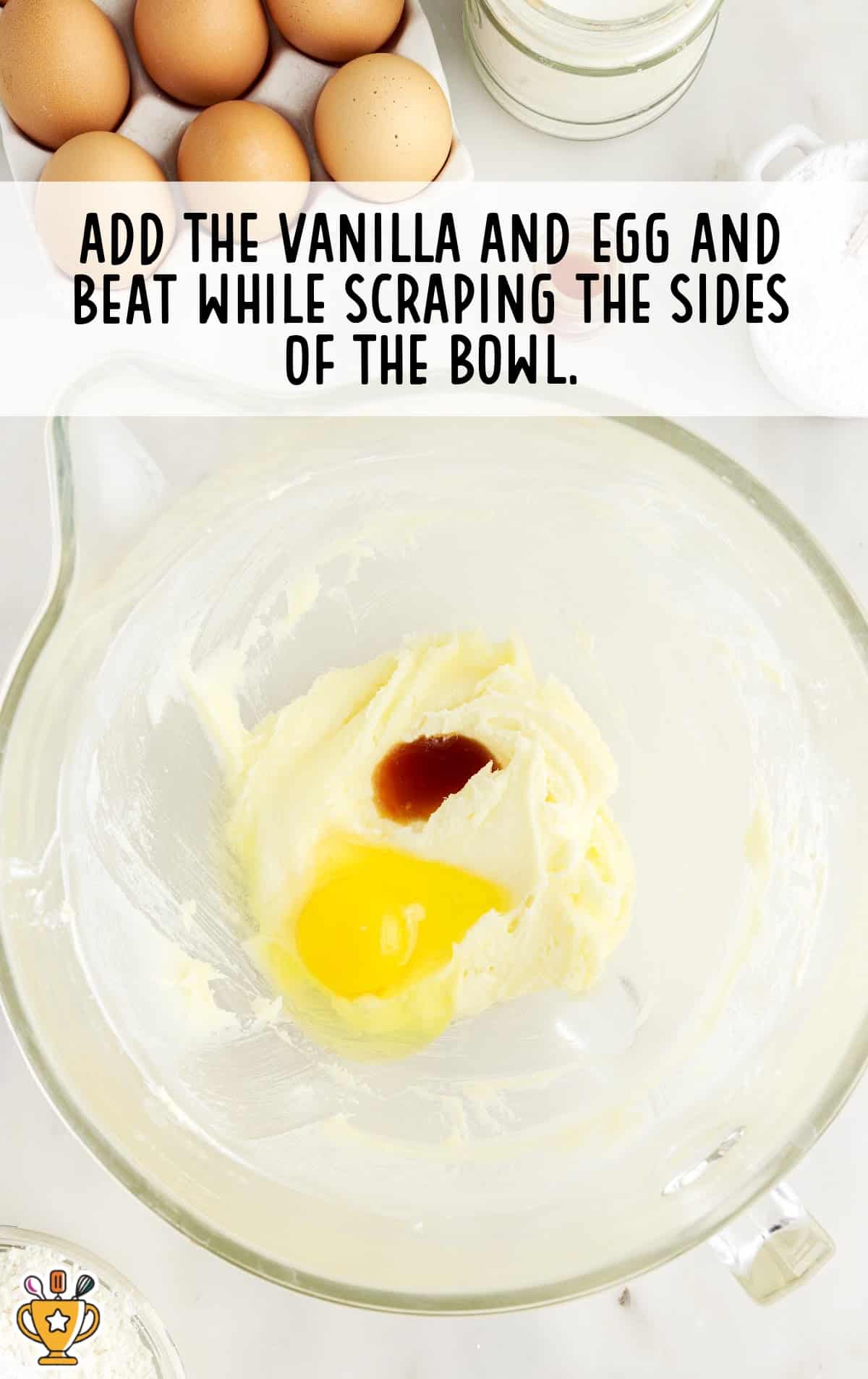 vanilla and egg added in a bowl