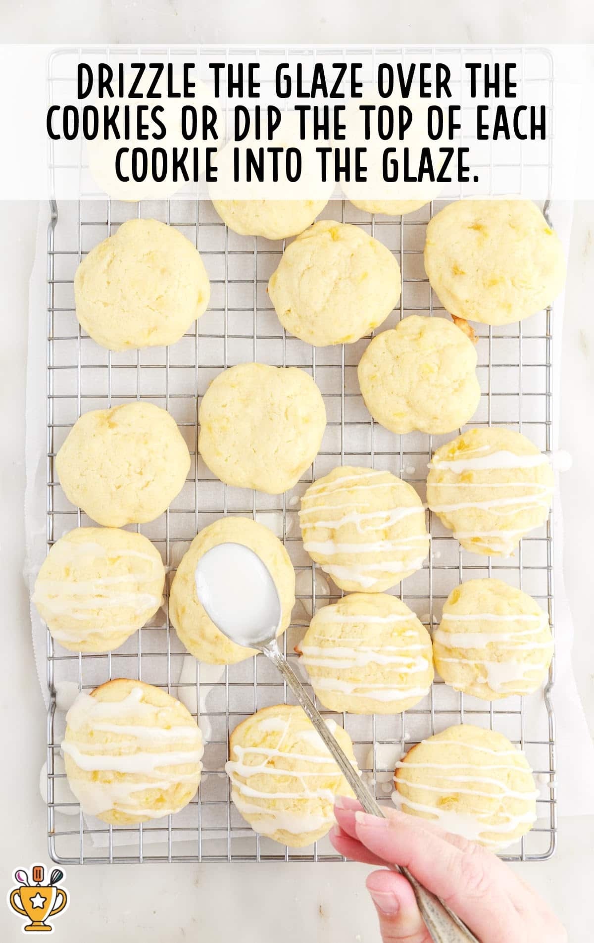 drizzling the glaze over the cookies