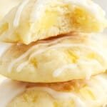 Stack of soft pineapple cookies drizzled with icing, featuring a bite revealing juicy pineapple chunks. Bold text reads "Pineapple Cookies – So Sweet & So Fresh!" on a bright, tropical background.