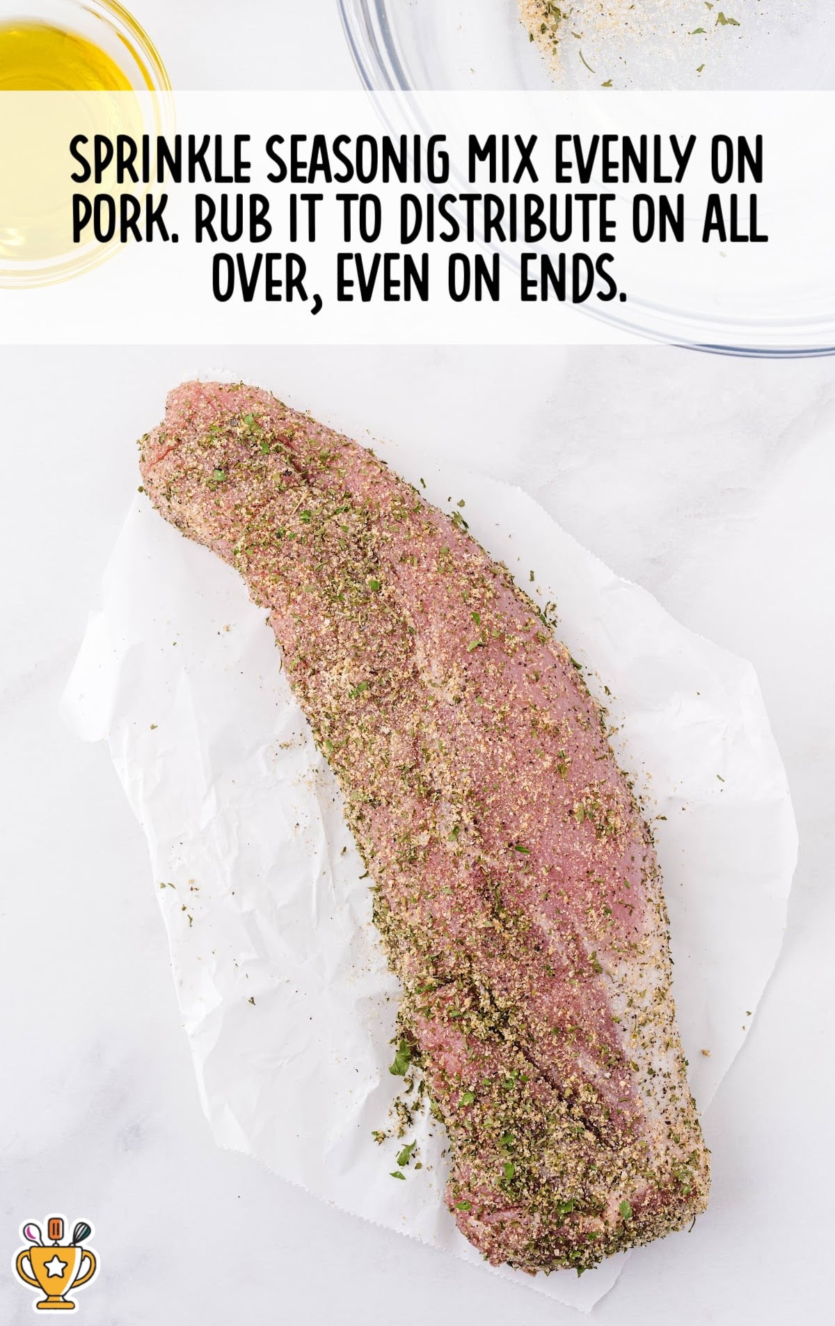 sprinkling seasoning mix on pork
