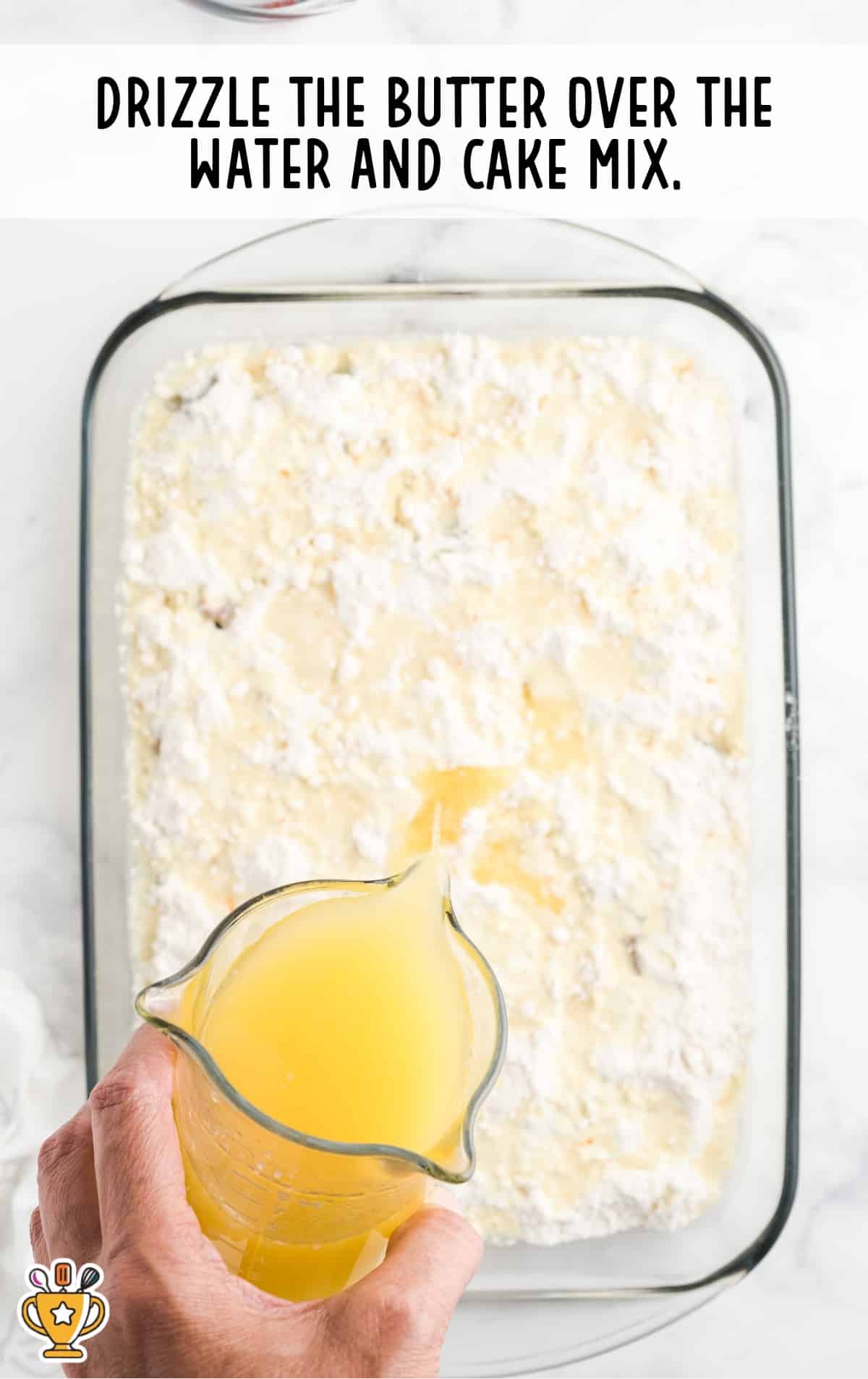 drizzling butter over the water and cake mix