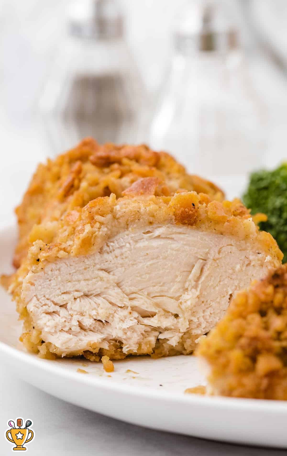 a white plate with a piece of Ritz Chicken