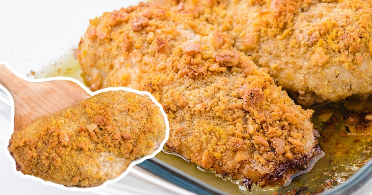 a wooden spoon holding a piece of Ritz Chicken and some other pieces in a container