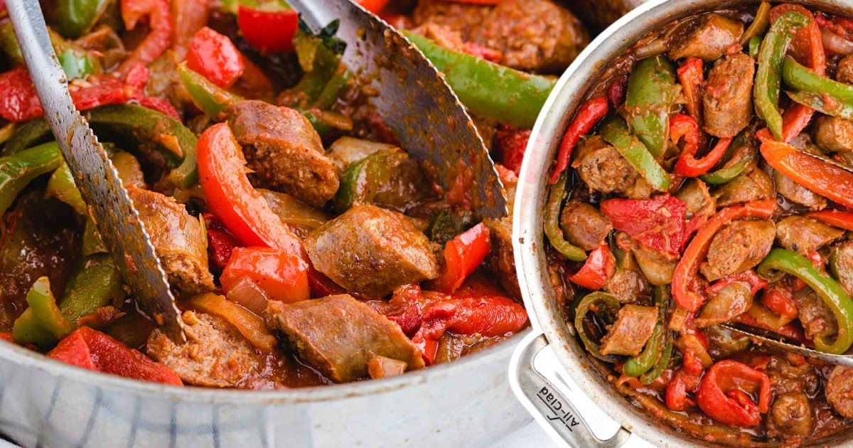 Sausage and peppers in a skillet, showcasing the rich, colorful ingredients cooked in a savory sauce.