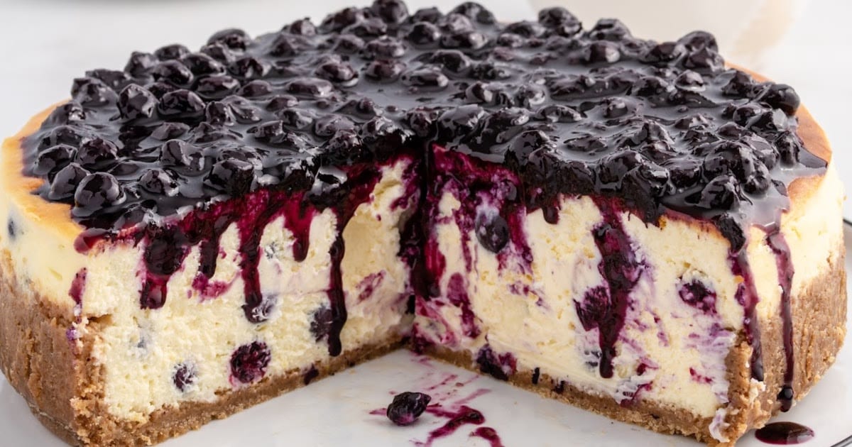 a Blueberry Cheesecake with a piece missing