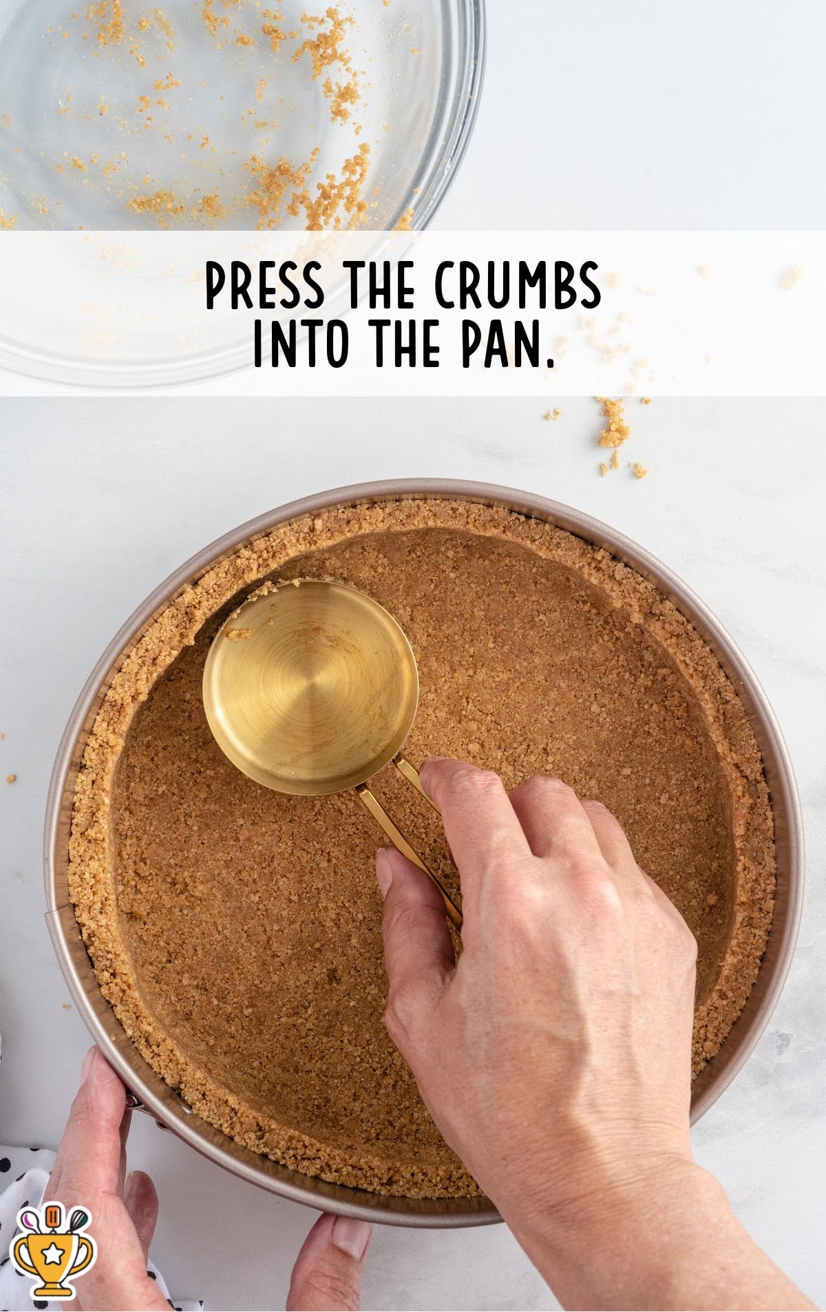 pressing the crumbs into the pan