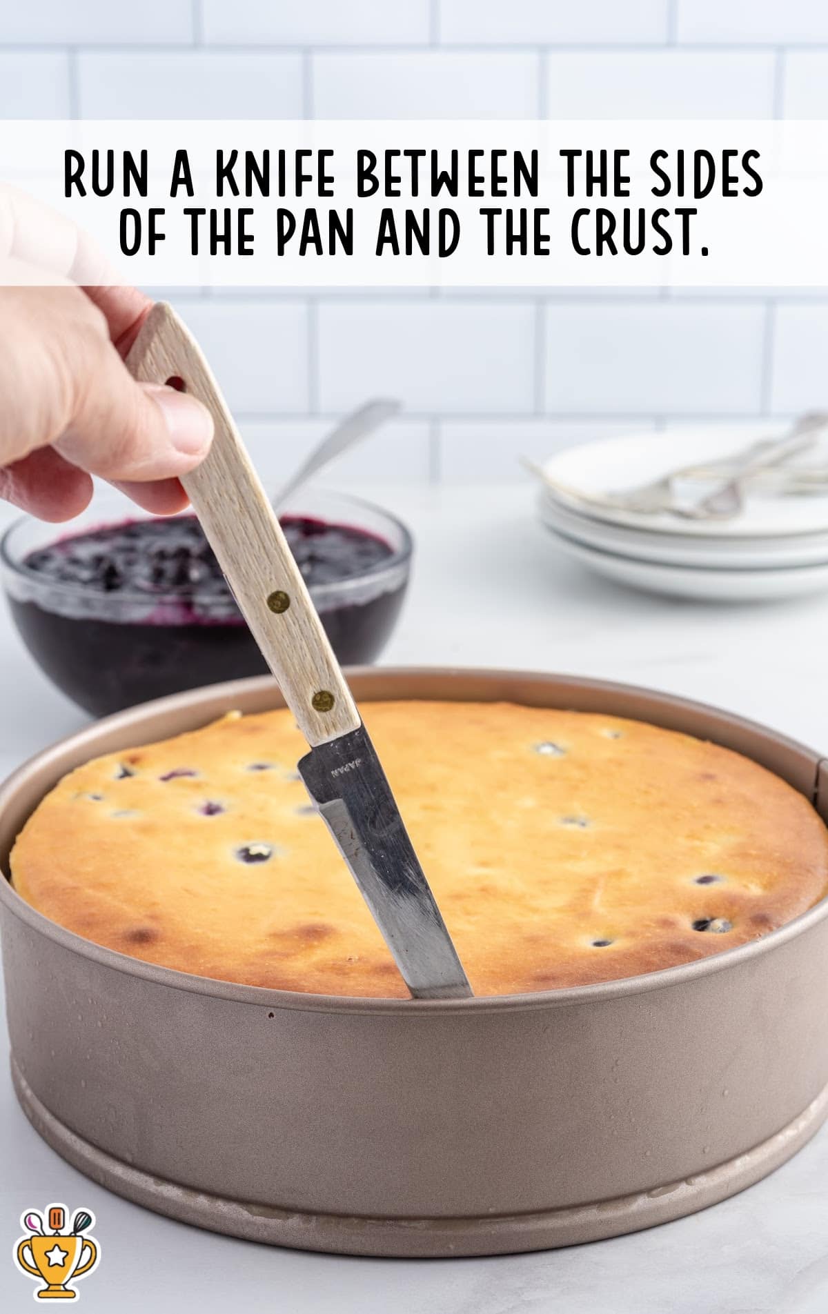 running a knife between the sides of the pan and the crust