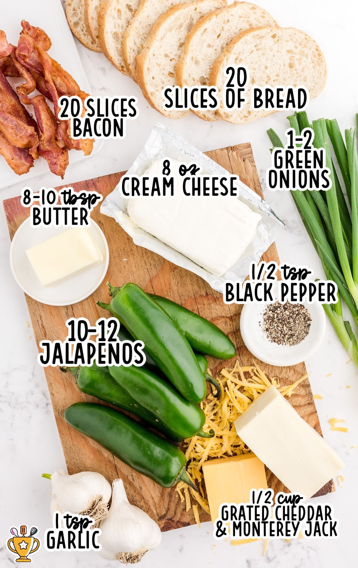 Flat lay of all ingredients: jalapeños, bacon, bread, cheeses, garlic, green onions, black pepper, and butter for the grilled cheese.