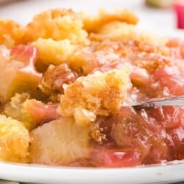 a white plate full of Rhubarb Dump Cake